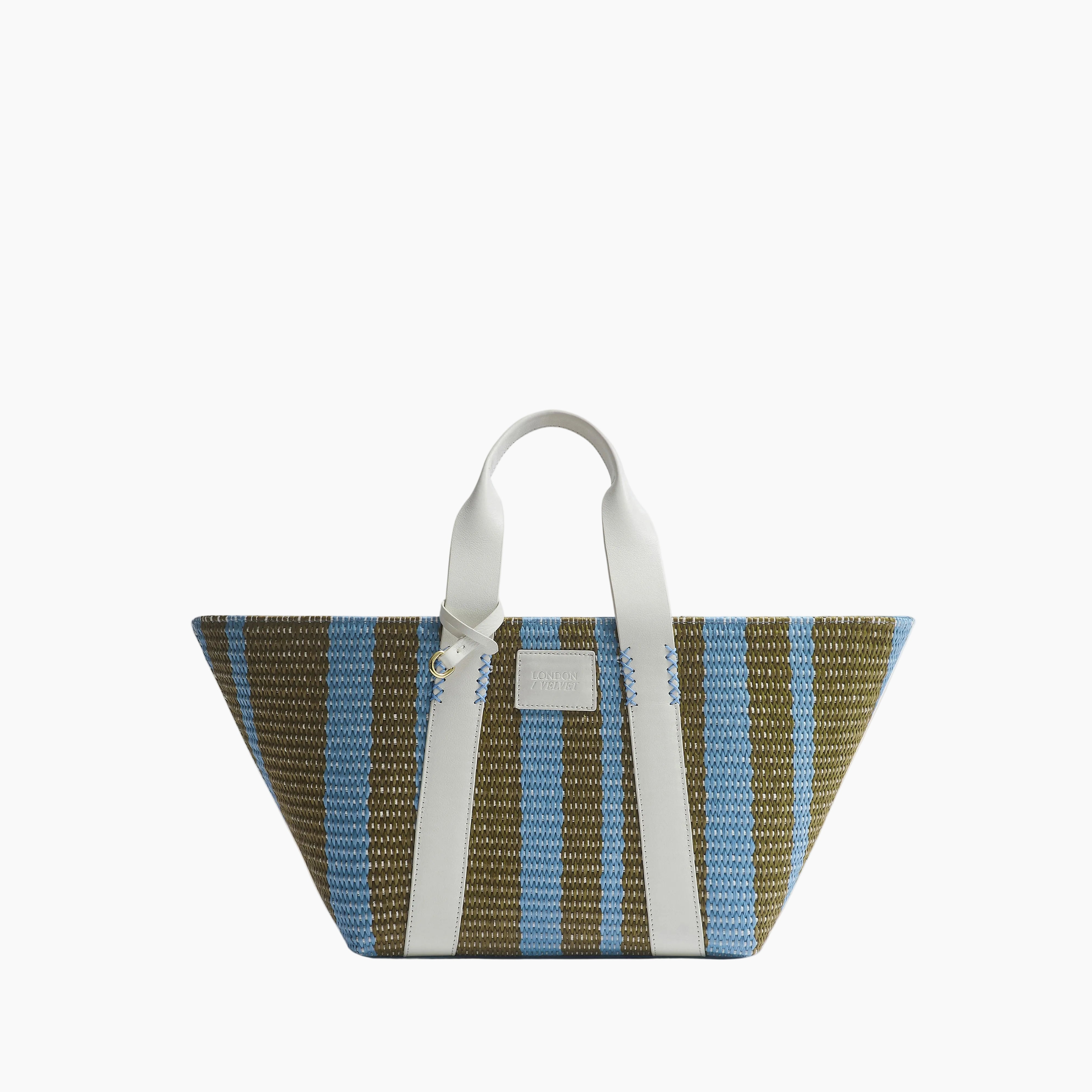 Striped woven bag with a handle on a light gray background