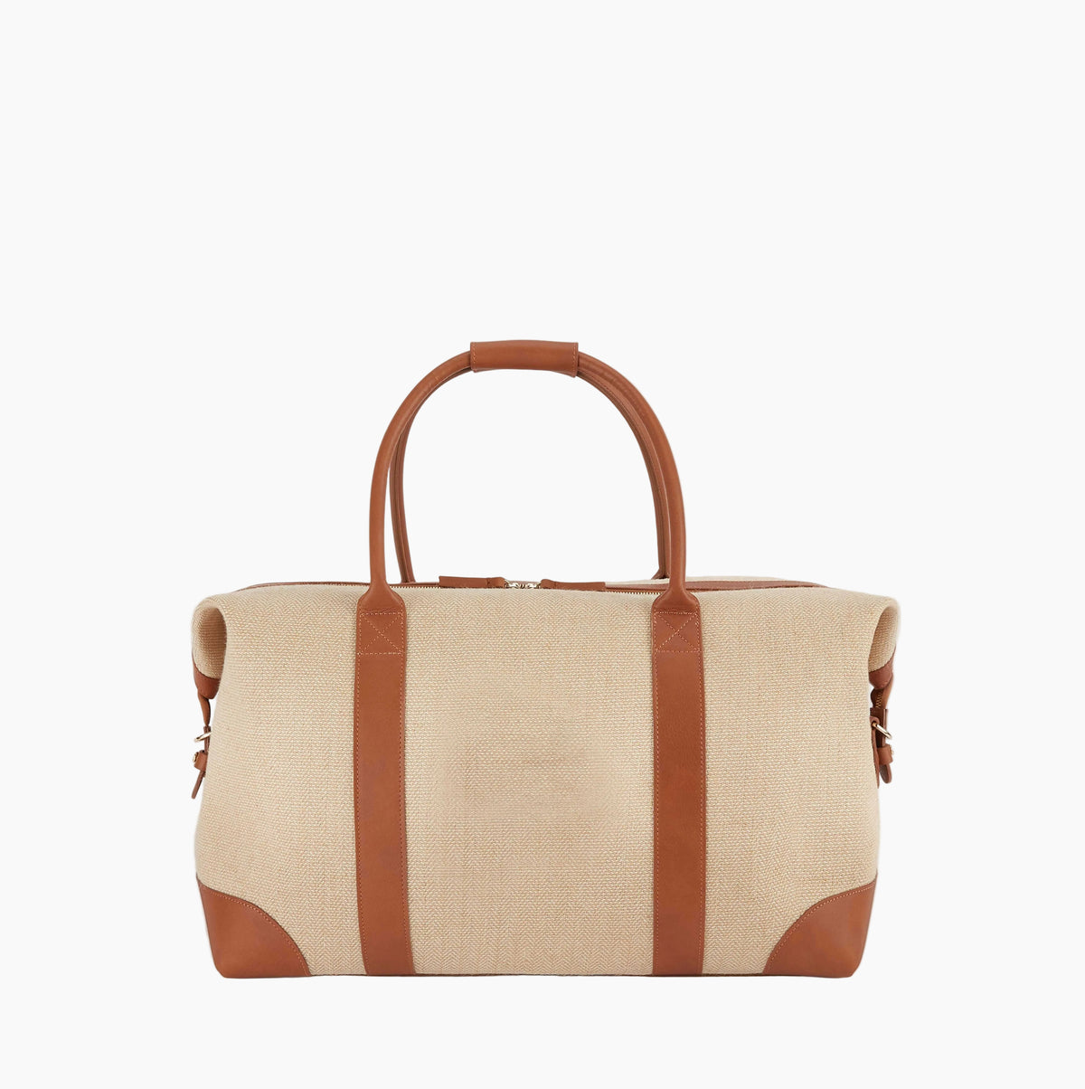 A beige canvas duffel bag with brown leather handles, corner protectors, and vertical trim, shown against a plain light gray background.