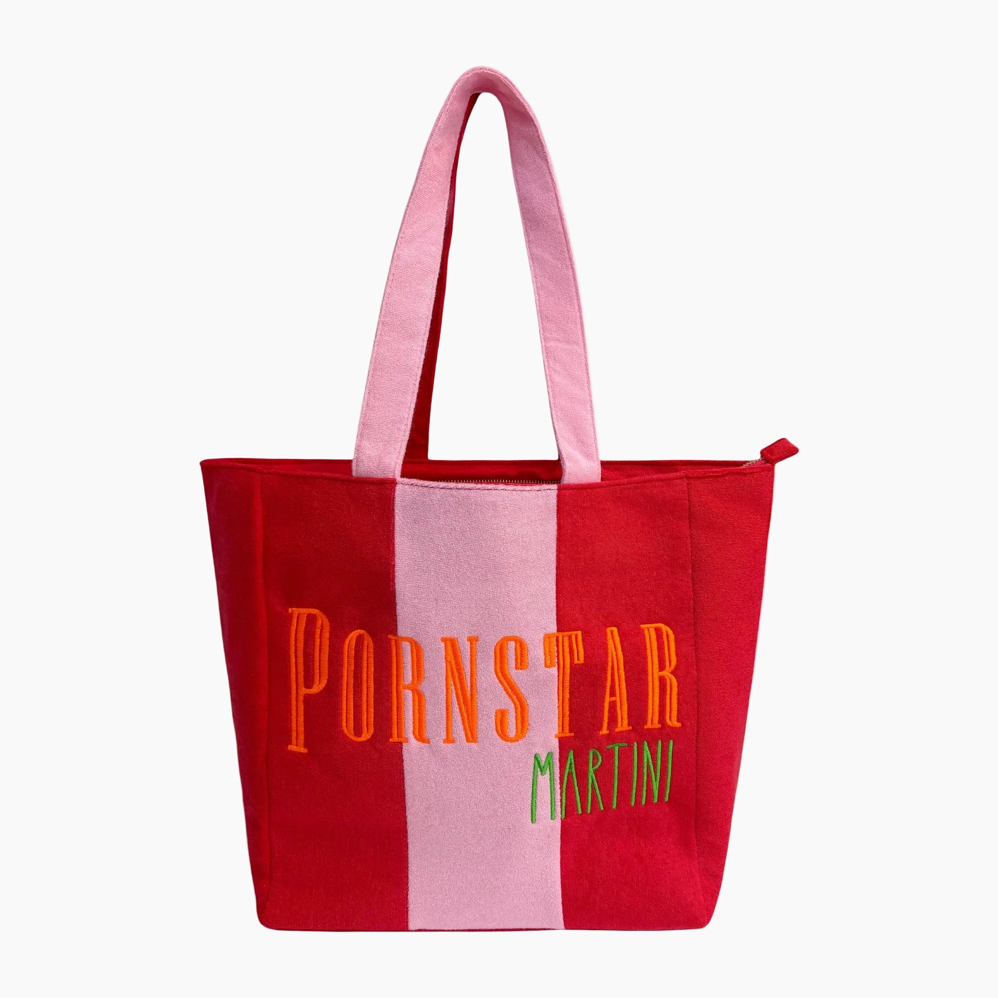 A red canvas tote bag with a vertical pink stripe down the center, featuring the text &