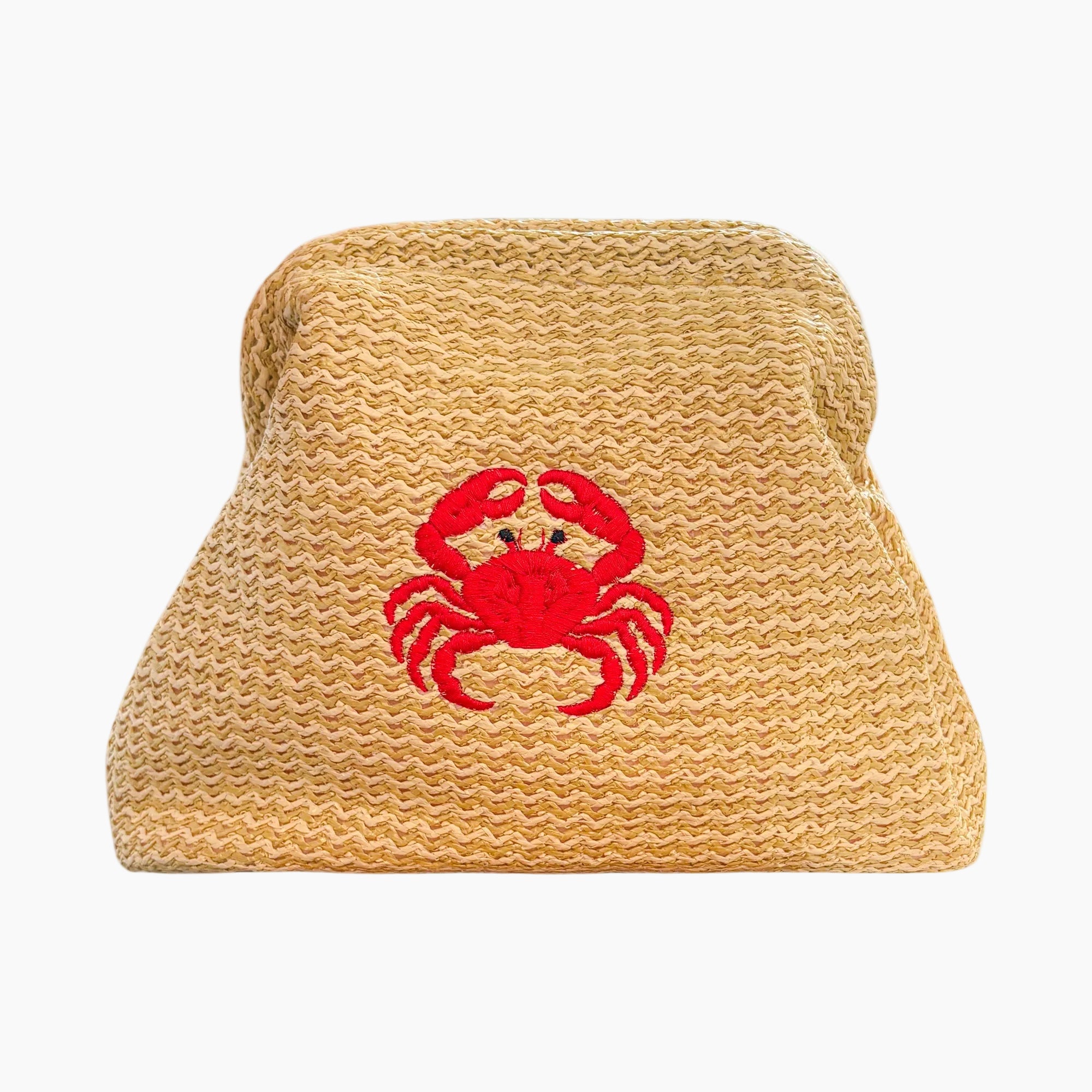Woven straw hat with a red crab design on a white background