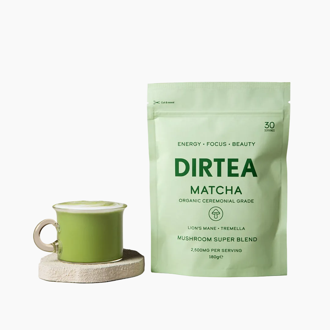 DIRTEA Matcha mushroom super blend packaging with a green tea cup on a beige background