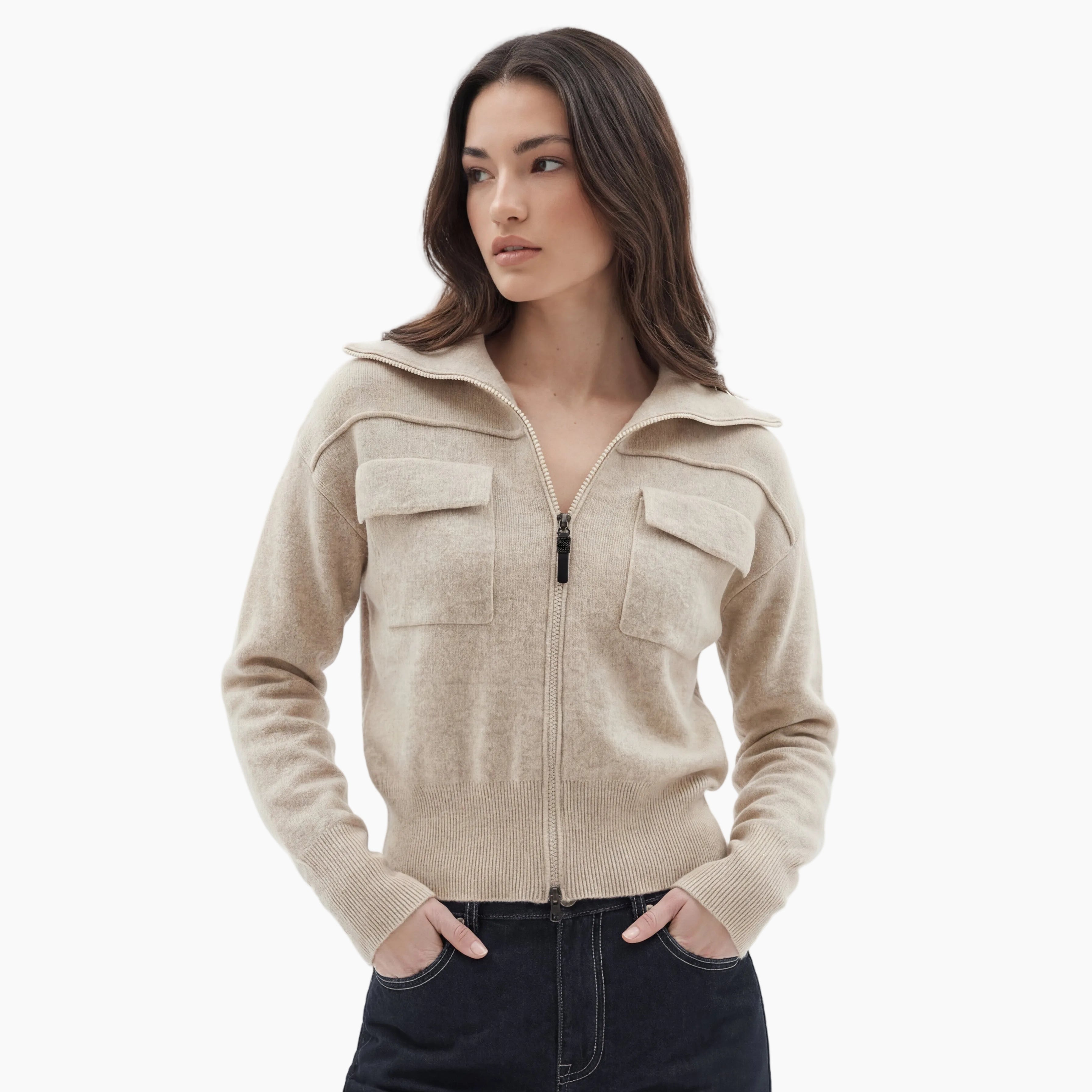 Woman wearing a beige zip-up hoodie on a white background
