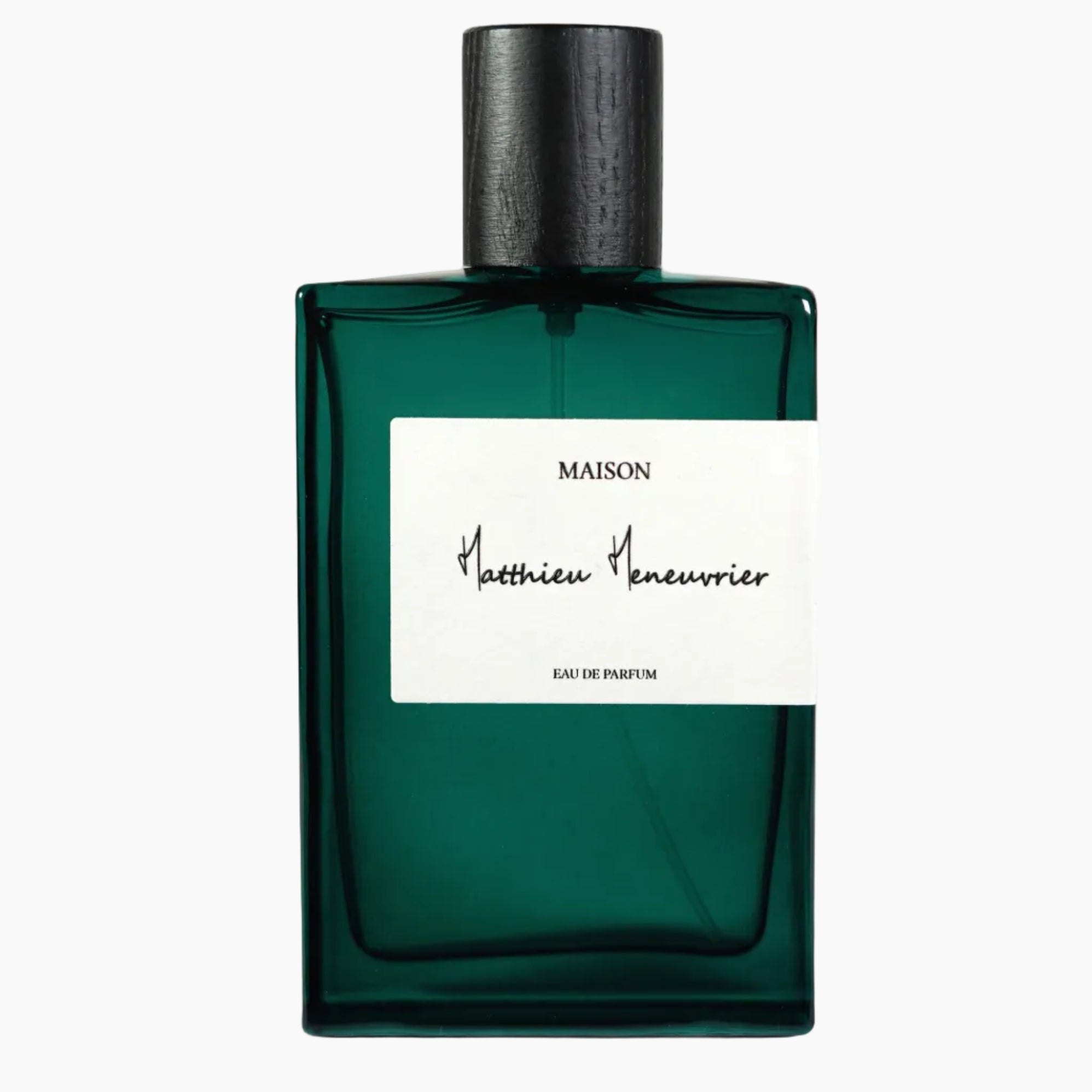 Green perfume bottle with a white label on a white background
