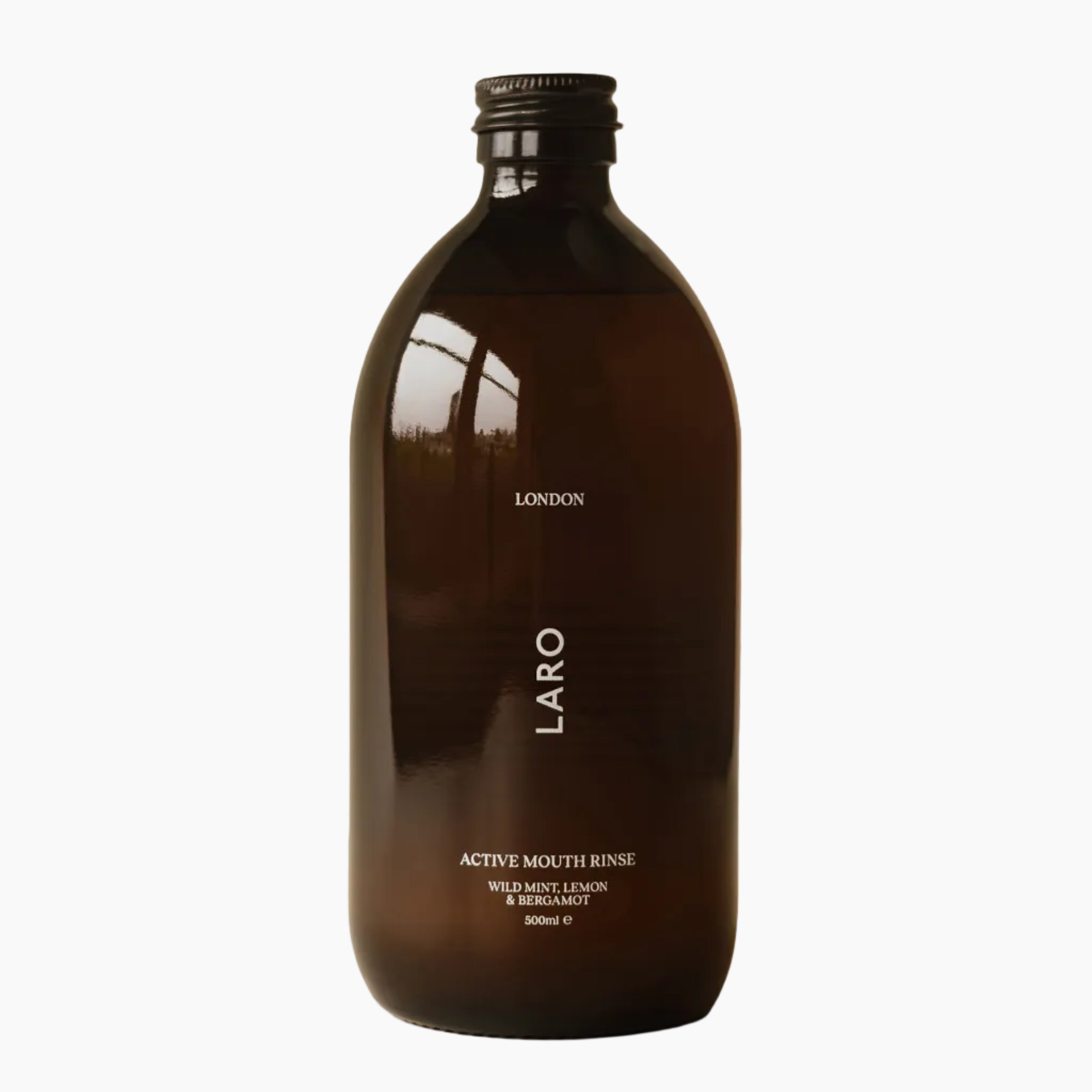 Brown bottle of Laro Active Mouth Rinse on a beige background