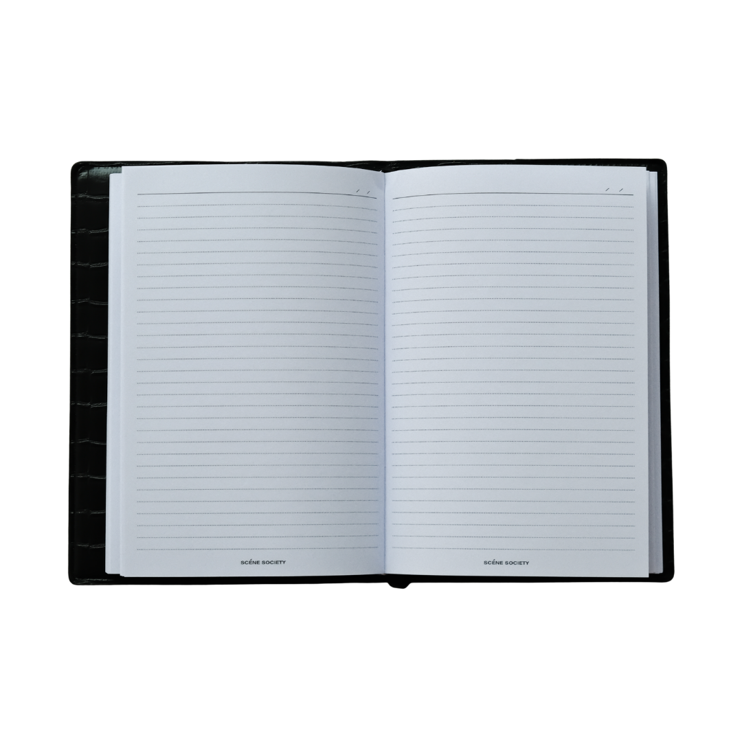 Open notebook with lined pages on a white background