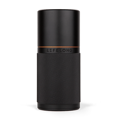 Dark refillable deodorant with knurled texture, small bronze details and a logo saying Lifelong in the middle.