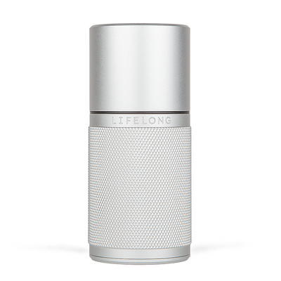 Silver-coloured refillable deodorant with knurled texture, small black details and a logo saying Lifelong in the middle.