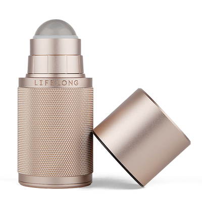 Rose-coloured refillable deodorant with lid off. It has knurled texture and a Lifelong logo in the middle. The lid has dark discrete details. 