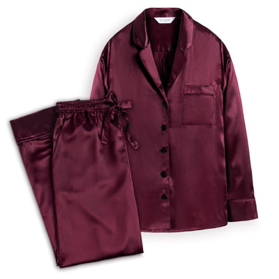 Full length silk pyjamas in a plum colour.