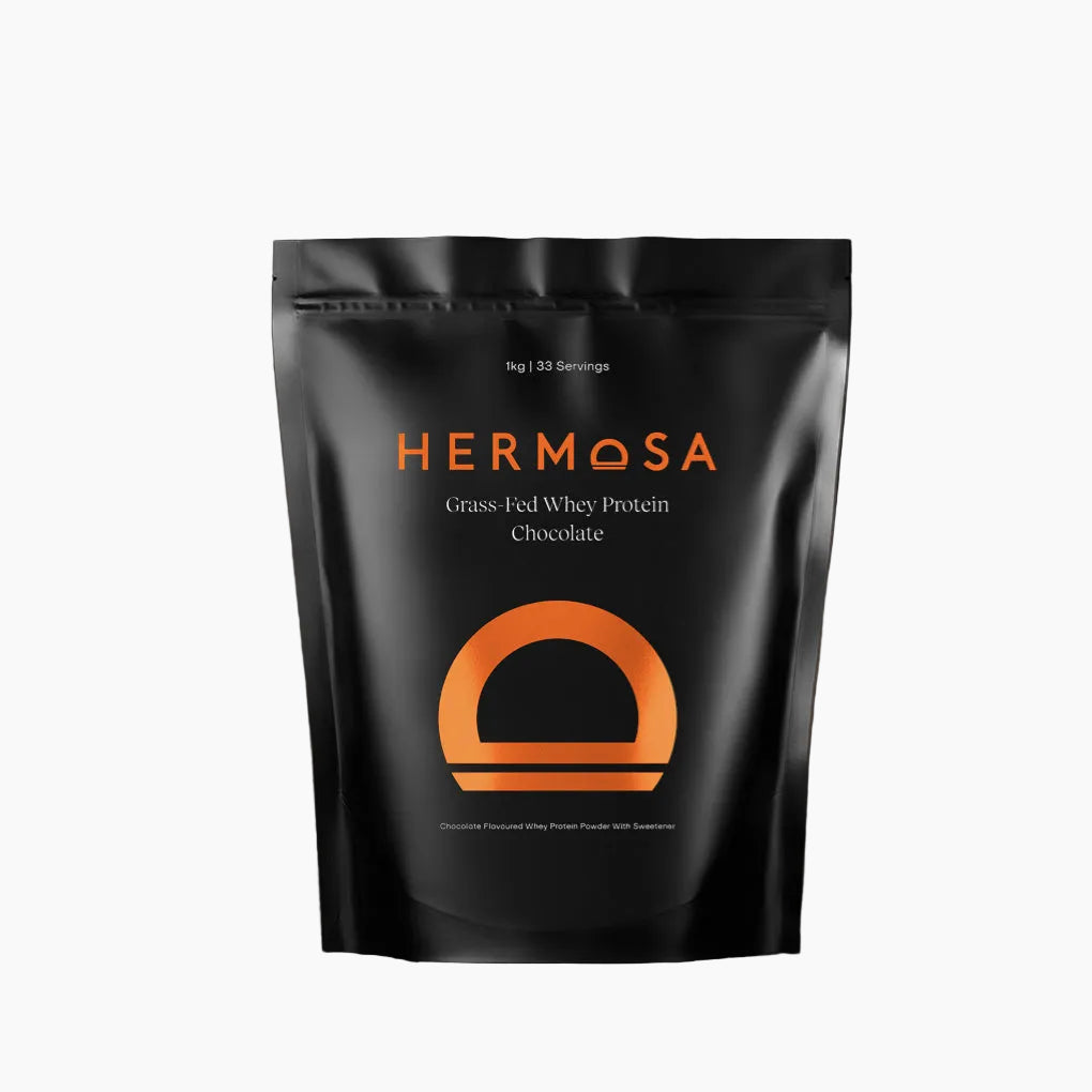 Hermosa Grass Fed Whey Protein Chocolate package on a dark background