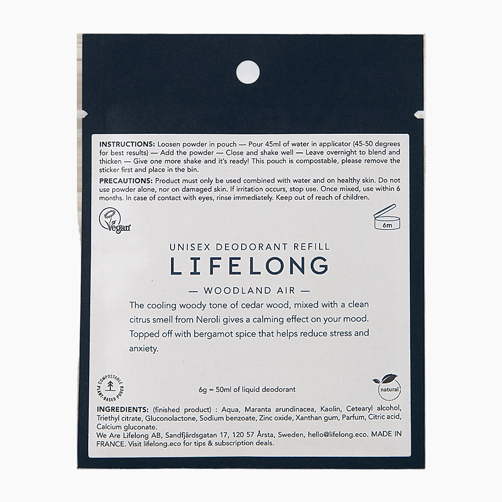 Black pouch with white label. Label describes the scent "Woodland air". The pouch is a refill for refillable sustainable roll-on deodorant from the brand Lifelong. 