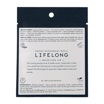 Black pouch with white label. Label describes the scent "Woodland air". The pouch is a refill for refillable sustainable roll-on deodorant from the brand Lifelong. 