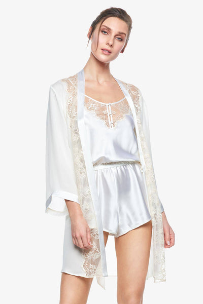 Model showcasing an open Cordelia pearl-white silk bridal robe