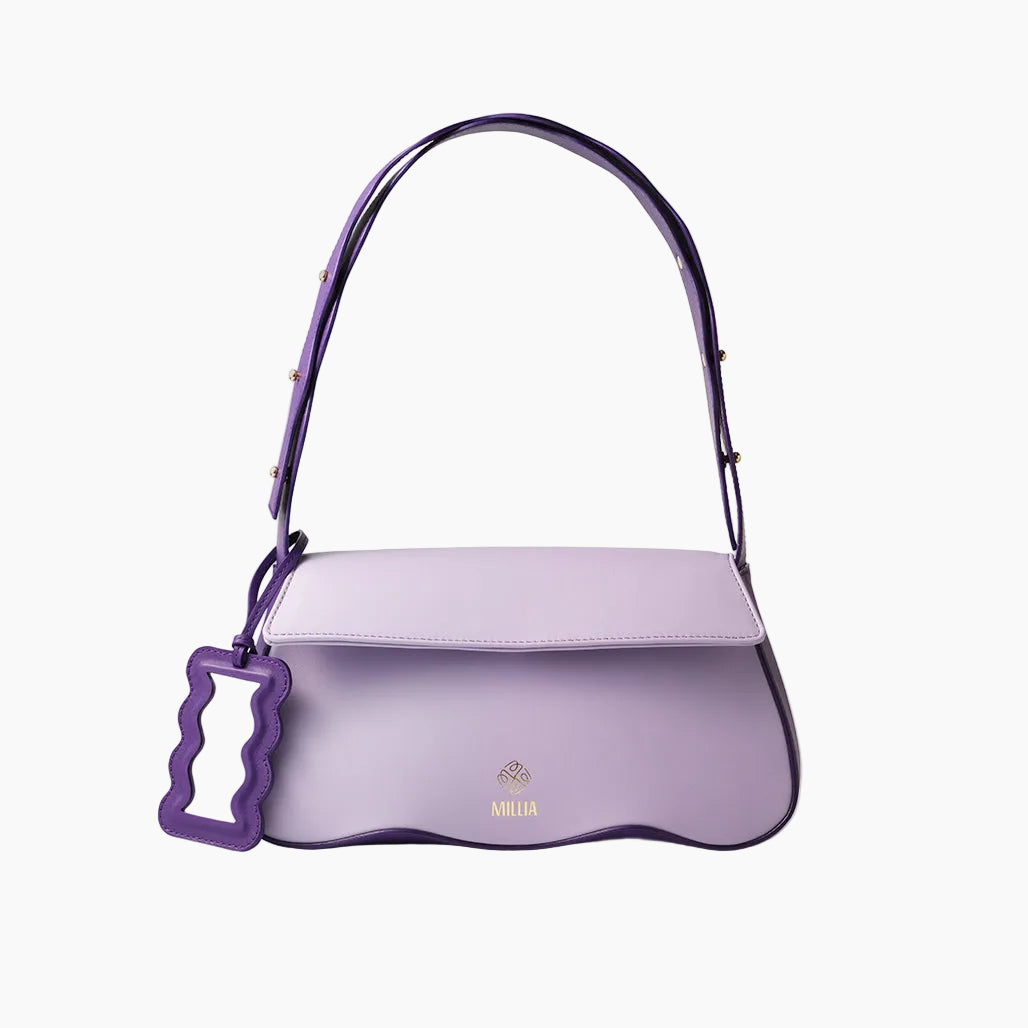 Purple handbag with a decorative handle on a light gray background