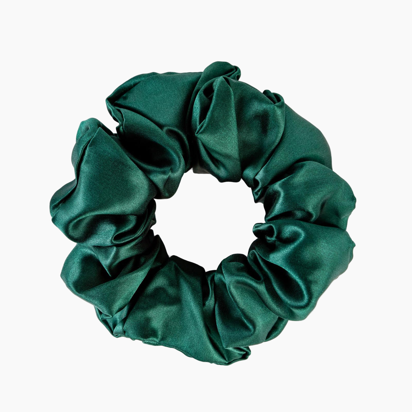 Silk Works large emerald green mulberry silk scrunchie with a smooth, lustrous finish for gentle hair styling.