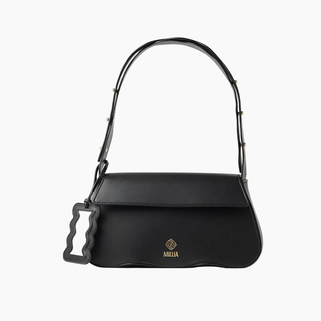 Black handbag with a decorative handle on a white background